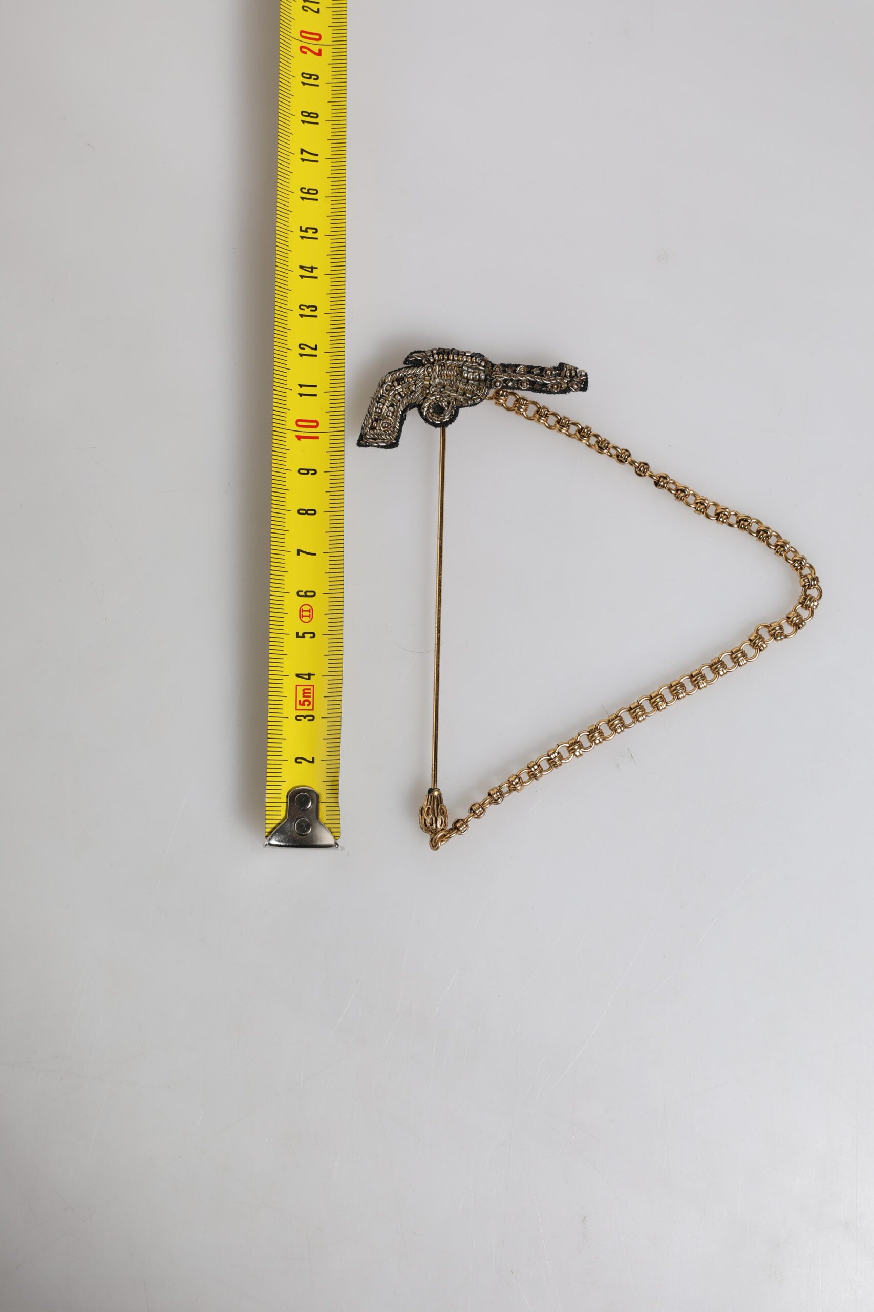 Dolce & Gabbana Black Gold Brass Copper Revolver Brooch Lapel Pin - Zeiniez